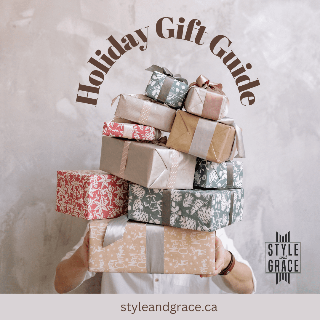 A person is hidden by a stack of holiday gifts, all wrapped in coordinating paper