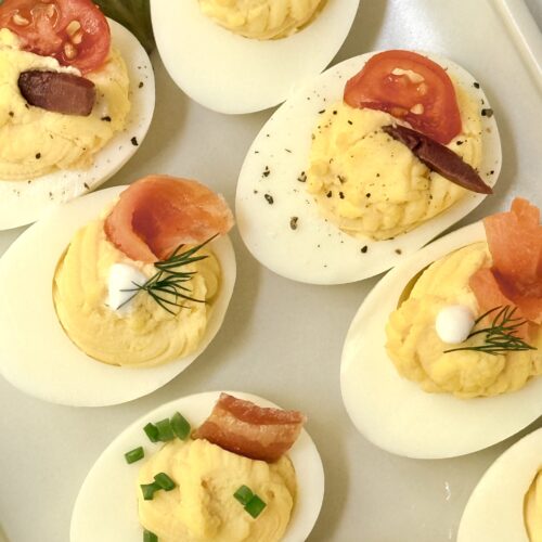 Devilled eggs are dressed up with savoury toppings for a beautiful and easy to eat appetizer