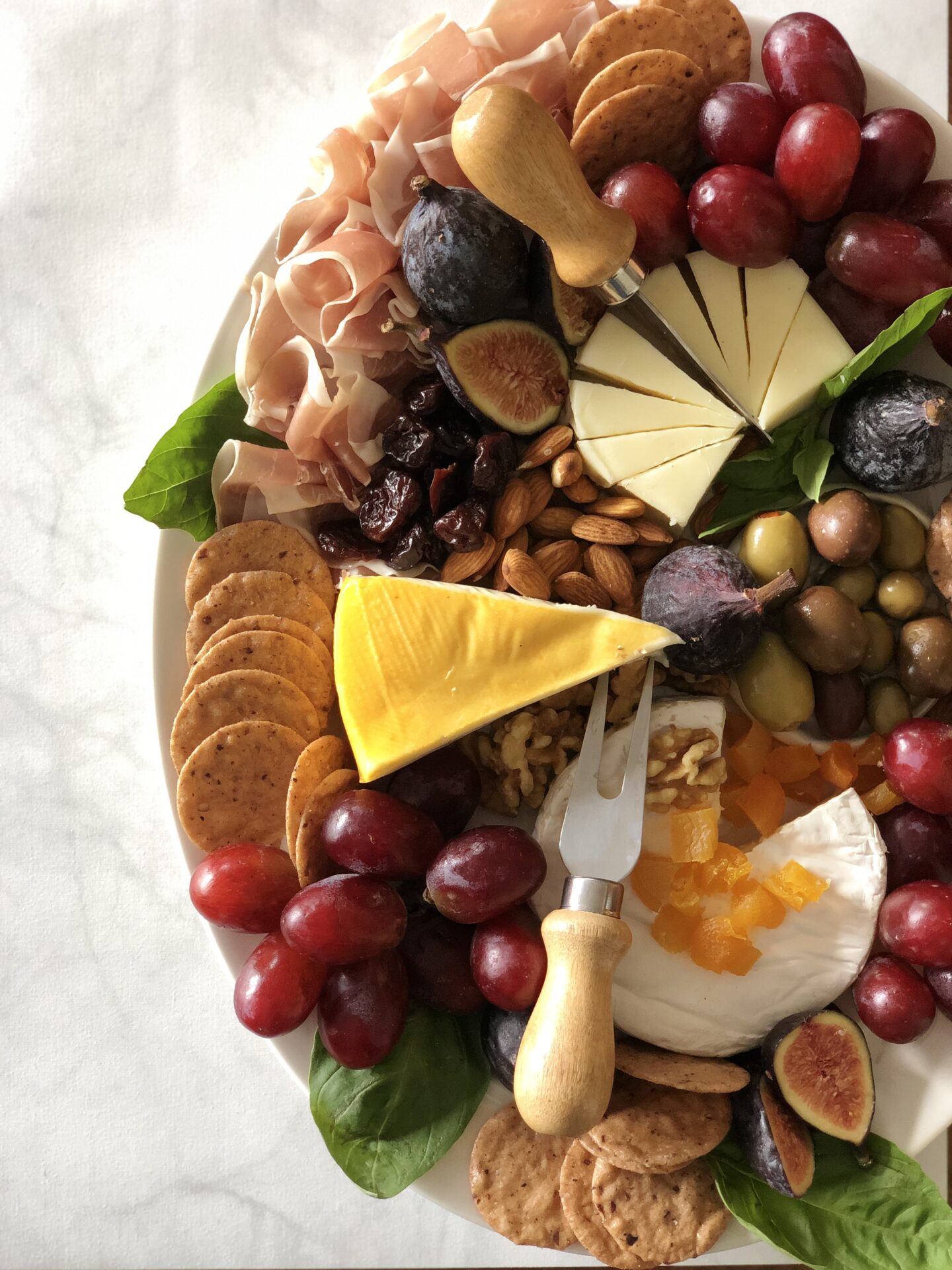 cheese and charcuterie plate with fruit