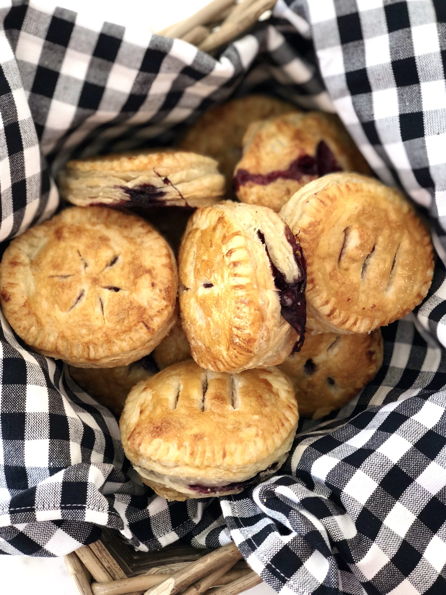 Basket of Blueberry hand pies at a picnic
