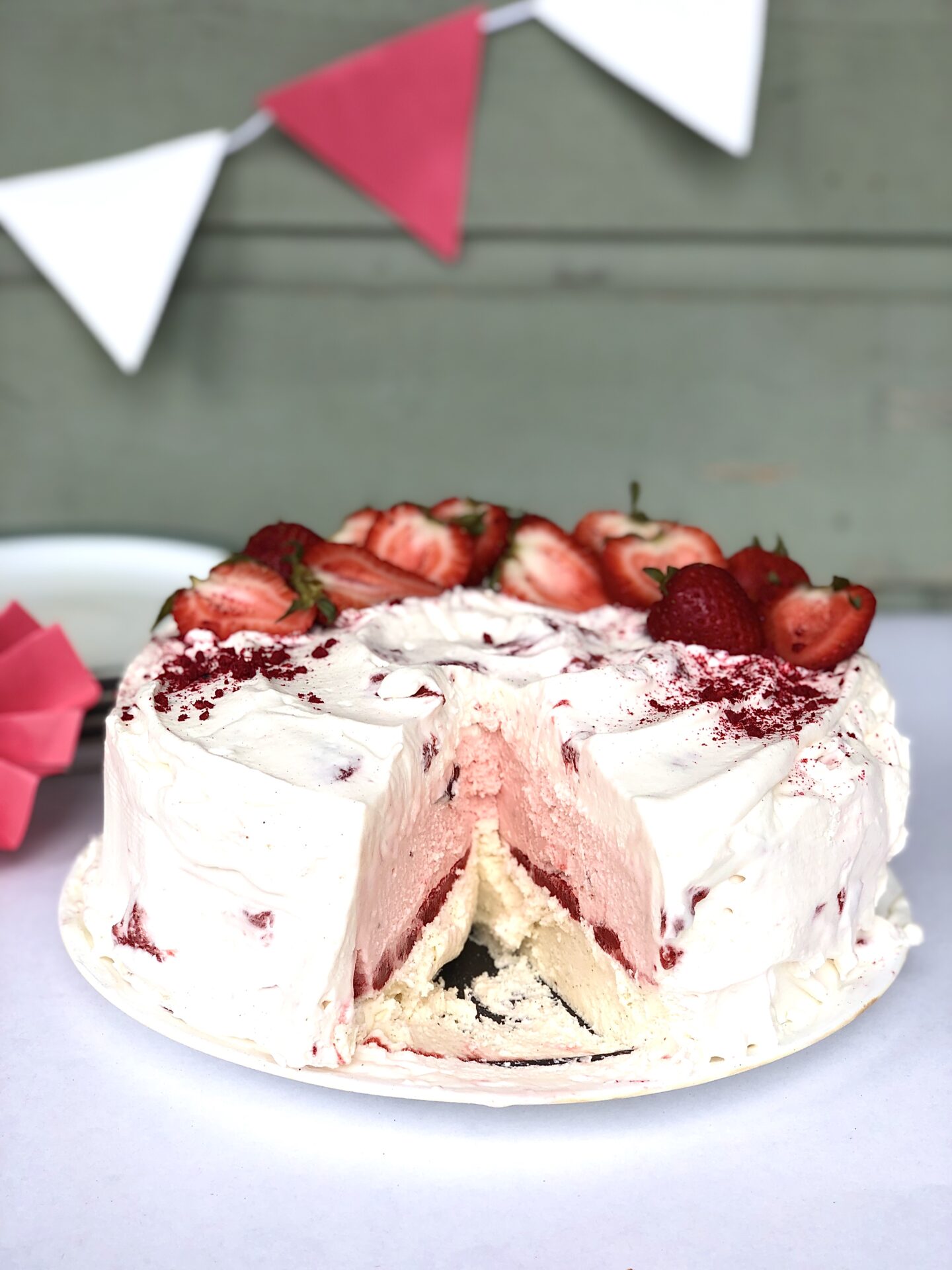 Strawberries and Cream Ice Cream Cake with slice removed to reveal layers