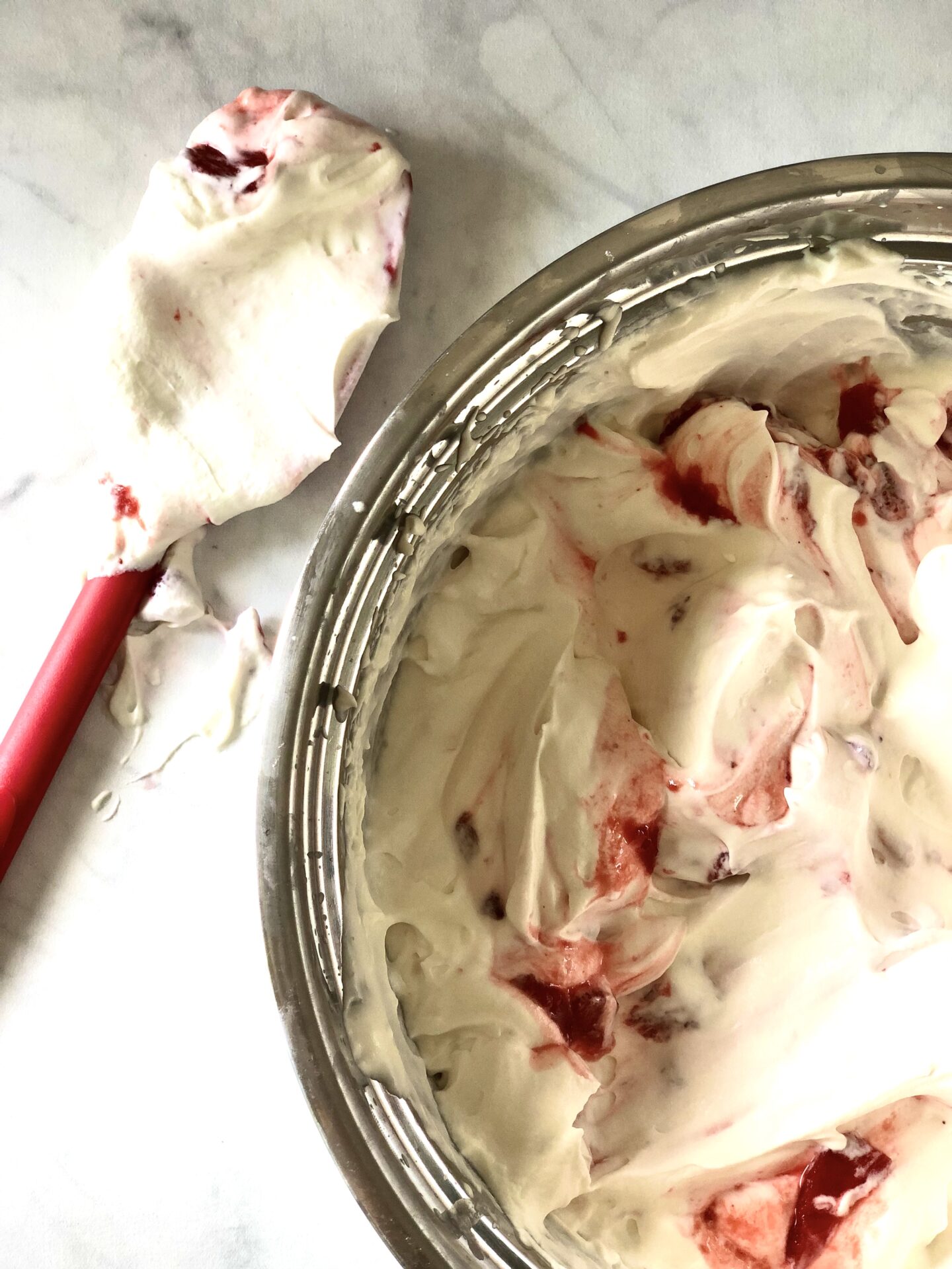 Mixing bowl of strawberries and cream