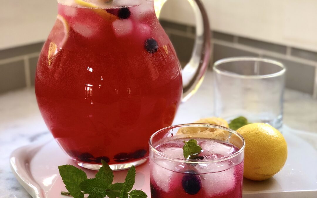 Glass pitcher of blueberry lavender lemonade
