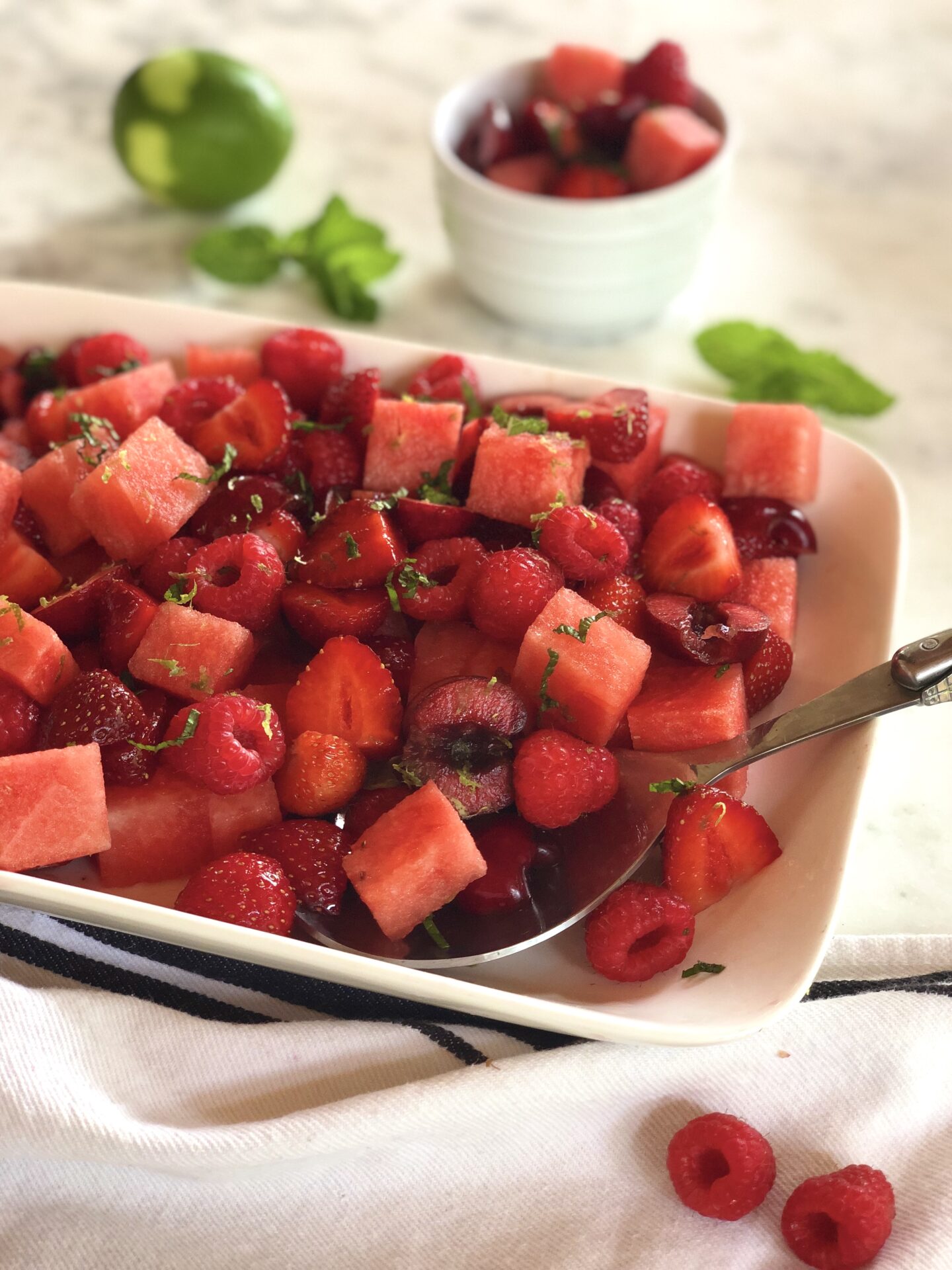 Red fruit salad with berries cherries and watermelon