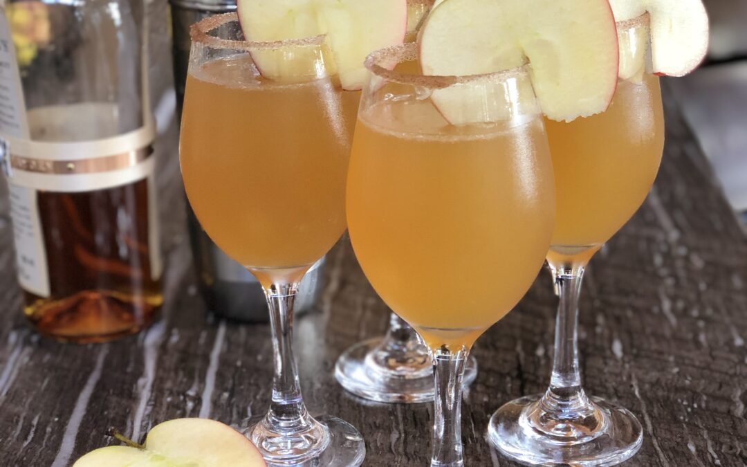 Bourbon Apple Cider Cocktails with cinnamon sugar rim and apple slice garnish