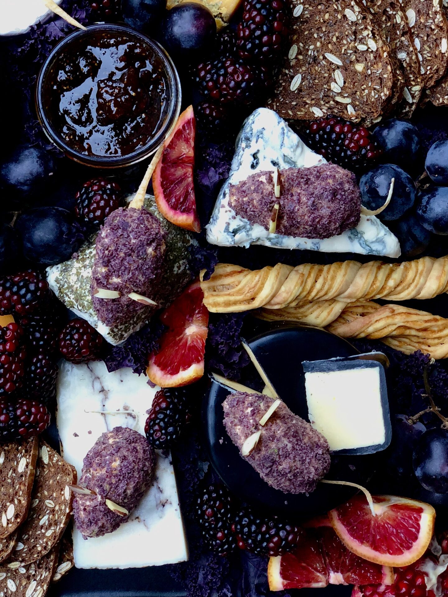 Cheddar Cheese Mice on a dark and moody Halloween themed cheese platter