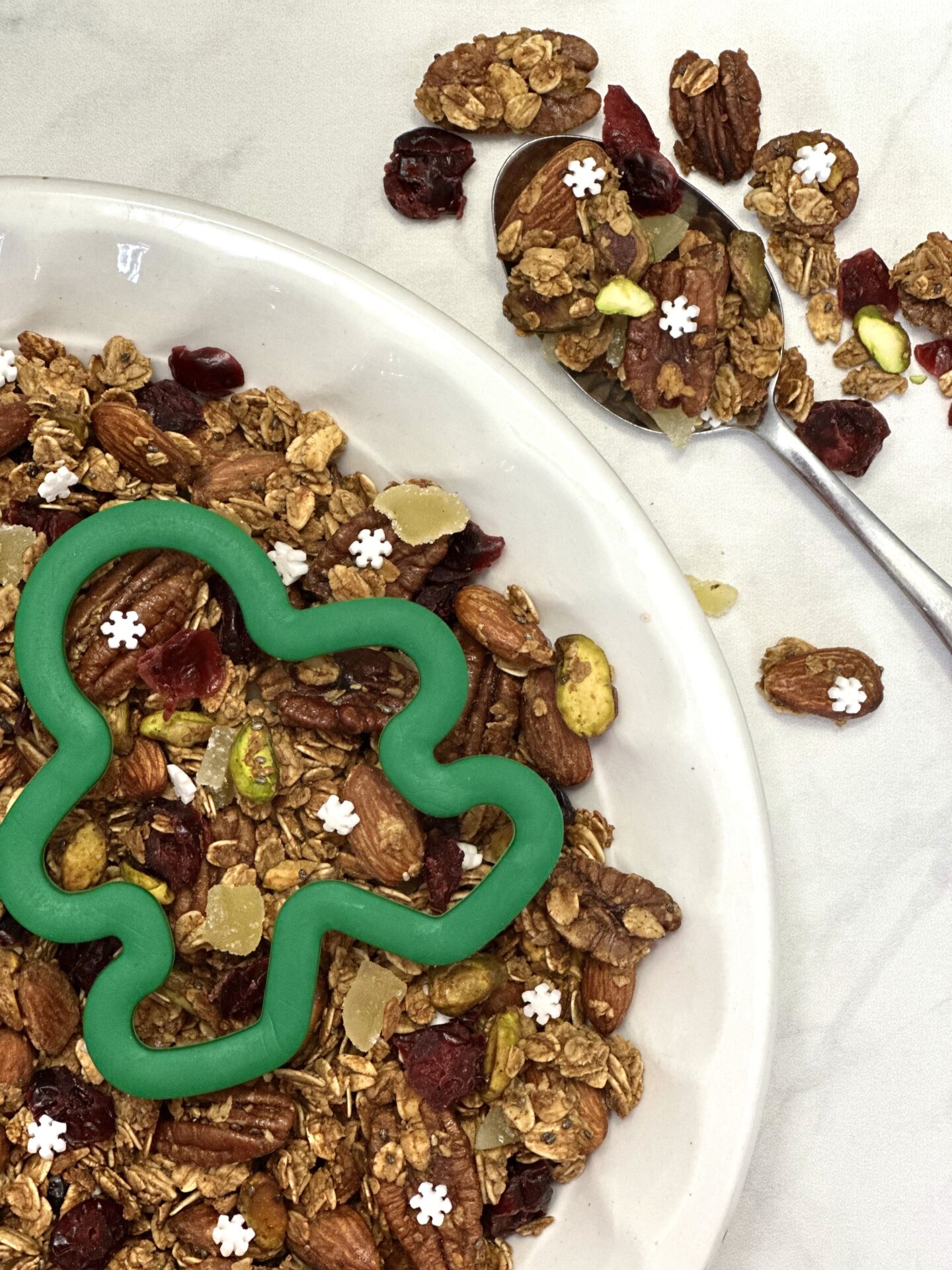 Homemade gingerbread granola with dried cranberries and snowflake sprinkles