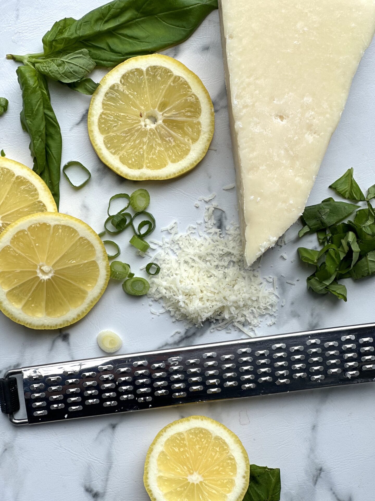 Lemon slices, chopped green onions, fresh basil leaves. and freshly grated parmesan cheese for garnishing Spring Straciatella Soup